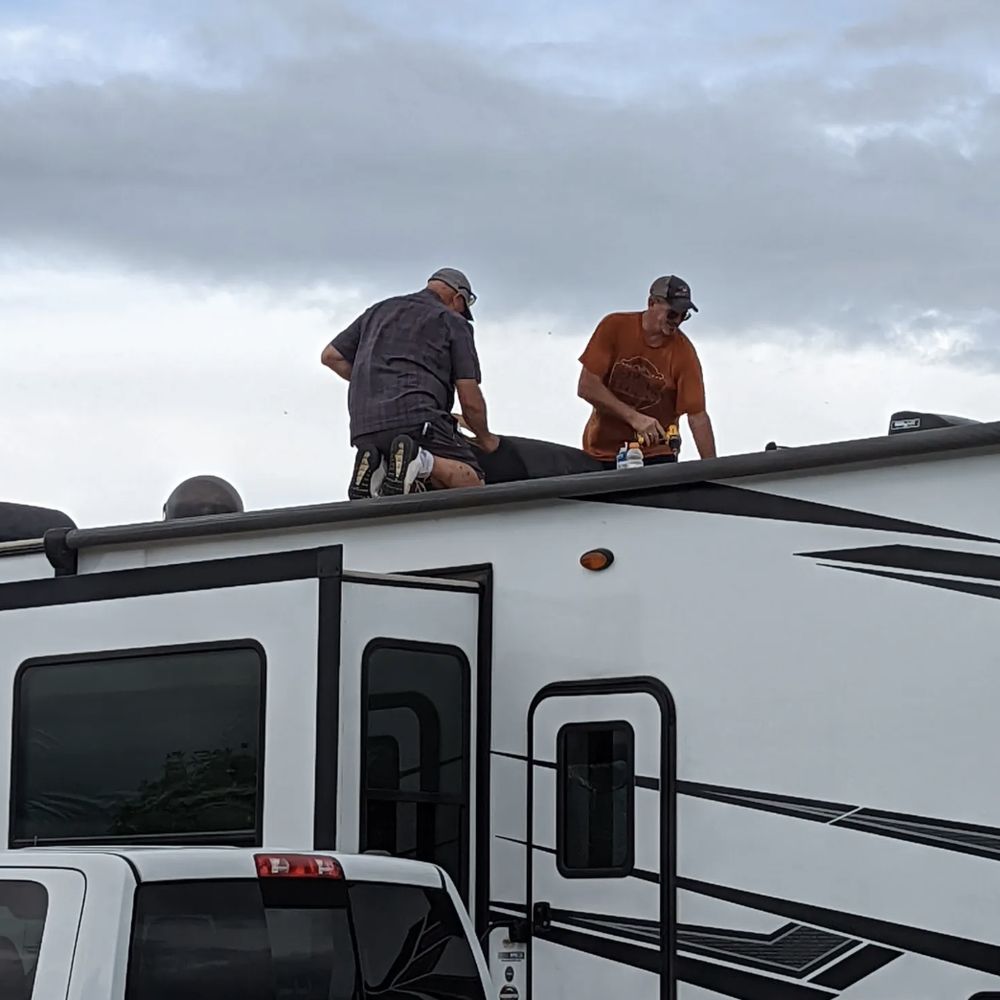 Technicians sealing an RV roof in Salt Lake City, UT